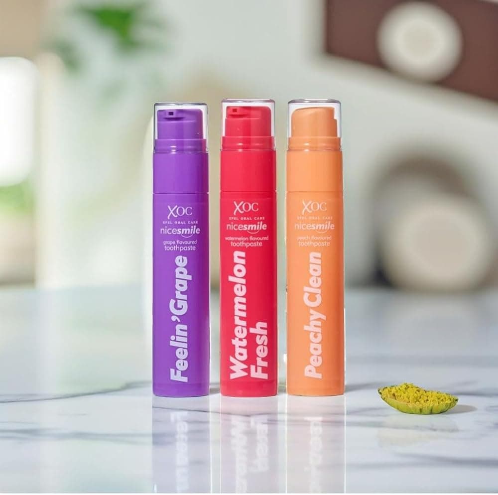 Nice Smile toothpaste tubes standing on a bright bathroom counter